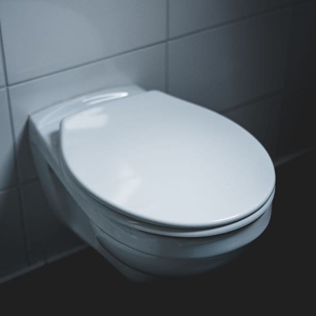 A clean white toilet in a bright bathroom